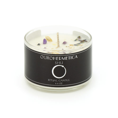 3.6 ounce candle in clear jar with black OuroHermetica label with white ouroboros icon